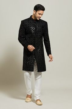 Black sherwani featuring geometric floral pattern in thread and sequin work. Paired with a white churidar. - Aza Fashions Black Sherwani, White Churidar, Black Thread, Churidar, Mandarin Collar, Aza Fashion, Black Velvet, Floral Pattern, Sequin