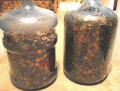 two large jars are sitting on the floor next to each other with coins in them