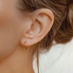 Tiny Classic Cartilage Earrings For Everyday, Classic Tiny Cartilage Earrings For Everyday Wear, Tiny Classic 14k Gold Hoop Earrings, Classic Tiny Hoop Earrings, Tiny Classic Hoop Earrings, Classic Tiny Sterling Silver Huggie Earrings, Delicate Yellow Gold Sterling Silver Hoop Earrings, Delicate Tiny Yellow Gold Hoop Earrings, Delicate Sterling Silver Hoop Earrings In Yellow Gold