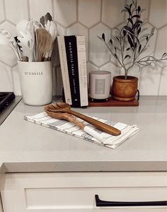 the kitchen counter is clean and ready to be used as a utensil holder