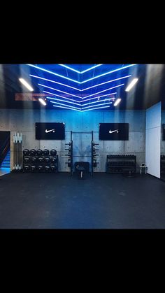 the inside of a gym with blue lighting