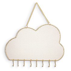 a white cloud hanging on a gold chain with hooks attached to the front of it