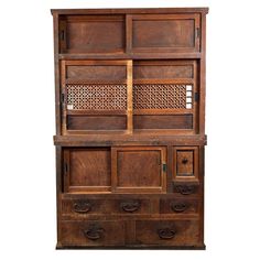 an old wooden bookcase with drawers on the top and bottom, against a white background