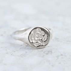 Our classic round signet has been hand engraved with a wax seal Rose. We are able to custom make any signet ring with your initials or family crest. Face measures 11mm round. Rose Signet Ring, Signet Ring Engraving, Family Ring, Silver Signet Ring, Rose Ring, Instagram Icons, Family Crest, Wax Seal, Caicos Islands