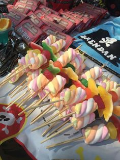 many colorful lollipops are on sticks