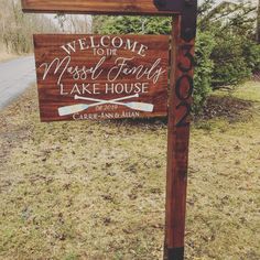 a welcome sign for the russell family lake house