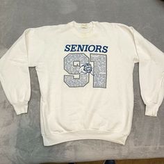 Some staining around the collar. See pics. All offers considered! Seniors Baker Class Of 1991 Lions Sweatshirt White Fruit Of The Loom XL CP Throwback Long Sleeve T-shirt For College, Pre-shrunk Vintage Sweatshirt For Fans, Vintage Pre-shrunk Sweatshirt For Fan Merchandise, Vintage Pre-shrunk Sweatshirt For Fans, Vintage Sweatshirt For Sports Season Fan Merchandise, Vintage Fan Merchandise Graphic Sweatshirt, Vintage Graphic Print Sweatshirt For Sports Season, Vintage Graphic Print Sweatshirt For Fan Merchandise, Vintage Crew Neck Tops For Sports Events