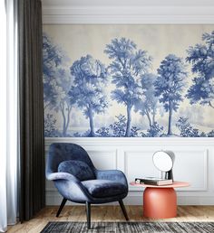 a chair and table in front of a wall with trees on it