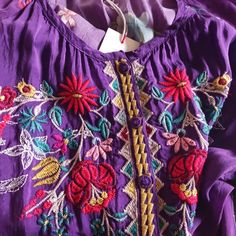 It Is Purple With Multiple Colors Of Embroidery. It Is So Striking. 100% Rayon. 3/4 Sleeves With Elastic At Sleeve Opening (Loose Fit). Buttons On Bodice Only. Pullover Style. Loose And Flowy. Pair With White Linen Pants At The Resort, And You Will Stop Everything And Everyone! It Says It Is A Medium, But This One Runs Large. It Would Fit An Xl Comfortably! Purple Embroidered Top With Floral Embroidery For Summer, Purple Floral Embroidered Top For Summer, Embroidered Bohemian Purple Blouse, Bohemian Embroidered Purple Blouse, Bohemian Purple Blouse With Floral Embroidery, Bohemian Purple Top With Floral Embroidery, Purple Embroidered Bohemian Blouse, Purple Bohemian Top With Floral Embroidery, Bohemian Purple Embroidered Blouse