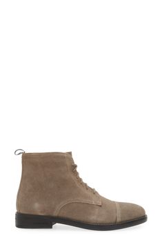 This cap-toe boot is shaped from supple leather and grounds any ensemble in timeless style. 5 1/4" shaft height Leather upper and lining/rubber sole Imported Classic Cap Toe Chelsea Boots For Fall, Fall Suede Lace-up Boots With Plain Toe, Fall High-top Boots With Rubber Toe Cap, Classic Cap Toe Lace-up Boots With Reinforced Heel, Winter Lace-up Cap Toe Boots With Brogue Detailing, Winter Lace-up Boots With Brogue Detailing And Cap Toe, Winter Cap Toe Lace-up Boots With Brogue Detailing, Winter Business Cap Toe Boots, Business Lace-up Boots With Cap Toe For Winter