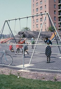 children playing on a playground in the city