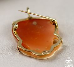 "Brand: M+M Scognamiglio Metal: 14k Yellow Gold (.585) Weight: 7.2 grams Measurements: 1.5\" Long; 1\" Wide Markings: 14K 585 Italy *Delicately hand-carved, this beautiful carnelian shell cameo pendant / brooch features an image of a beautiful lady facing right with her flowing hair held back by a floral headband. The cameo of the woman is set in a lovely 14k yellow gold bezel that really accentuates the wondrous carving. This outstanding Victorian cameo is in great condition, with light wear. T Elegant Orange Brooch Jewelry, Orange Brooch Jewelry For Formal Occasions, Formal Orange Brooch Jewelry, Elegant Orange Ceremonial Jewelry, Formal Cameo Jewelry In Carnelian, Formal Cameo Carnelian Jewelry, Formal Carnelian Cameo Jewelry, Yellow Gold Carnelian Wedding Jewelry, Gold Floral Headband