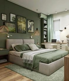 a bedroom with green walls and pictures on the wall above the bed, along with an area rug