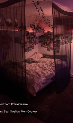 an image of a bed in the middle of a room with pictures hanging on the wall