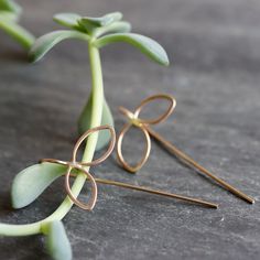 Sweet botanical earrings with a modern edge. These delicate petal threaders are subtle enough to wear everyday, with an interesting and somewhat unexpected design that you won't get tired of. 1/2" open petal shape dangles with fixed wire threader ear wire. Available in sterling silver, 14k gold fill (as shown), or mixed metal. All Rebecca Haas Jewelry is handcrafted by me in my Southern Vermont Studio from recycled and ethically sourced materials. Dainty Handmade Teardrop Threader Earrings, Delicate Gold Threader Earrings With Ear Wire, Delicate Sterling Silver Threader Earrings, Delicate 14k Gold Threader Earrings With Ear Wire, Delicate Nickel-free Drop Threader Earrings, Delicate Nickel-free Threader Drop Earrings, Delicate Rose Gold Threader Earrings, Everyday Earrings Simple, Contemporary Handmade Jewelry