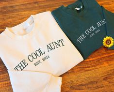 The Cool Aunt Embroidered Jumper, Personalized Date Embroidery Cool Aunt Crewneck Sweatshirt, Custom Crewneck Jumper, Birthday New Aunt Gift We are experts in creating tailored and top-quality personalization and customization experiences for clothing and accessories. Our committed team has the skills to bring your designs, logos, images, and creative concepts to life, enhancing a wide range of apparel with visually appealing results Make sure not to overlook our limited-time, exclusive offer! E Diy Gifts For Aunt, Aunt Gift Ideas, Date Embroidery, The Cool Aunt, Christmas Gifts For Aunts, Embroidered Jumper, Cool Aunt, Custom Crewneck, Baby Niece