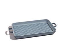 a gray and white checkered tray with handles