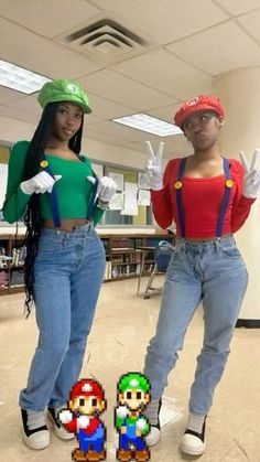 two people dressed up as mario and luigi