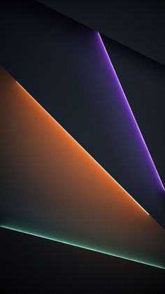 an orange and purple light shines brightly in the dark room, with no one visible