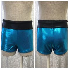 Turquoise mystique (holographic lycra) high waisted shorts with black mystique waistband. Disco Style Stretch Shorts, Disco Stretch Shorts, Disco Style Stretchy Shorts, Blue Cheerleading Shorts, Blue Shorts For Cheerleading, Blue Stretch Shorts For Cheerleading, Blue Fitted Shorts With Wide Waistband, Blue Stretch Rave Bottoms, Blue Stretch Bottoms For Cheerleading