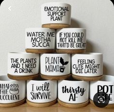 a stack of ceramic bowls sitting on top of a wooden table