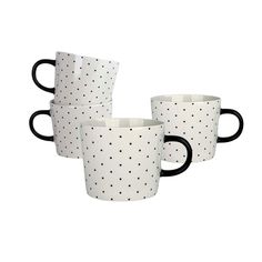 three black and white coffee mugs sitting next to each other on a white background