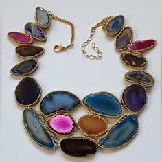 Nwot An Elegant Array Of Reconstructed Multicolor Agate Stones Creates A Statement Of Regal Beauty With This Stunning Necklace. Handmade By Artisans, This Bib Necklace Is A Unique Accent To Any Wardrobe. Please Note: The Handcrafted Nature Of This Product Will Produce Minor Imperfections Constant With Handmade Natural/Artisan Products. Perfect For Gift Giving To Someone Special Or Keep For Yourself! About This Item * Stone: Reconstructed Sliced Genuine Agate * Trim: Chainlink In Gold Finish Arou Unique Multicolor Jeweled Necklaces, Adjustable Multicolor Agate Necklace, Multicolor Gemstone Pendant Necklace, Multicolor Agate Necklace For Gift, Multicolor Beaded Necklaces With Natural Stones For Party, Multicolor Natural Stones Necklace For Party, Multicolor Gemstone Necklace For Party, Multicolor Agate Pendant Necklace, Multicolor Agate Stone Jewelry