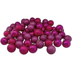 a pile of purple christmas balls sitting on top of each other