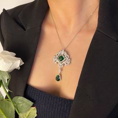 ✰ This green gemstone pendant decorated with cushion cut cubic zirconia and emerald green pear drop dangle which makes this  pendant look very retro ✰ This green jewelry has a pin on the back that can be used as a brooch or as a pendant ✰ This green pendant is perfect for people who want to achieve a brilliant and splendid look ✰ This large pendant not only suitable for formal occasions such as banquets, weddings, theme parties, but also for everyday wear ✰ Comes with an exquisite gift box and a chain Materials: Environmentally-friendly Copper Pendant Size: 2.68 x 1.52 in Main Gemstone Size: 0.4 x 0.4 in ----♛ PRODUCTION & SHIPPING ♛ --- ✰Multiple items purchased in one payment can be combined for shipping ----♛ Care Tips ♛ --- ✰ Scratches from daily wear are normal, and they can be more n Green Diamond Wedding Brooches, Elegant Green Diamond Brooch, Green Gemstone Pendant Brooches, Elegant Green Jeweled Brooches, Green Gemstone Wedding Brooches, Elegant Green Gemstone Brooches, Elegant Green Gemstone Brooch, Brooch Wedding, Green Pendant