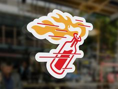 a sticker with an image of a test tube and flames coming out of it