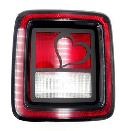 the tail light of a car with a heart on it