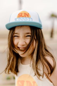 Summer is for sunkissed hair! Enjoy the ocean breeze while walking the boardwalk in this trucker hat. Made in Los Angeles Trendy Trucker Hat With Curved Bill For Beach, Trendy Curved Bill Trucker Hat For Beach, Blue Fun Snapback Hat For Summer, Fun Blue Snapback Hat For Summer, Playful Blue Trucker Hat For Summer, Playful Blue Summer Trucker Hat, Summer Snapback Trucker Hat With Upf 50+, Fun Blue Trucker Hat For Vacation, Fun Trucker Hat For Beach In Spring