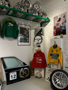 there is a car in the garage with other items on display