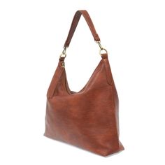 This oversized, slouchy, cool hobo bag is made of tumbled buffalo grain cinnamon-colored vegan leather, which gives it that casual boho chic look! With two included removable shoulder straps, you can wear it as a short shoulder bag or a crossbody bag. Dimensions: 13.5 in. H x 16 in. W x 3.5 in. D 2 Removable shoulder straps: Non-adjustable short shoulder strap drop: 10 in. Adjustable long shoulder strap: 21-25 in. 2 Interior open pockets Interior zip closure pocket Zippered Top Closure Exterior Soft Leather Hobo Bag For Fall, Fall Textured Leather Hobo Bag For Travel, Fall Travel Hobo Bag With Textured Leather, Fall Travel Textured Leather Hobo Bag, Versatile Brown Hobo Bag With Detachable Strap, Everyday Fall Hobo Bag With Leather Handles, Fall Hobo Bag With Leather Handles For Everyday, Fall Soft Leather Hobo Bag For Everyday, Versatile Brown Hobo Bag With Large Capacity