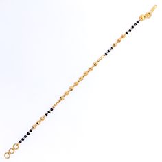 This stylish 22k gold bracelet, weighing 4.5 grams, features brilliant black beads that enhance its radiant yellow gold finish. The 7-inch length, paired with adjustable 0.6-inch links, ensures a comfortable and secure fit. Secured with a hook lock, this bracelet offers a chic and sophisticated look, making it a perfect accessory for both everyday wear and special occasions. PRODUCT DETAILS Gold Purity(karat): 22k Item Weight(grams): 4.5 Item Finish: Yellow Gold Stone: Black Bead Bracelet Length Traditional Gold Bracelets With Black Beads, Traditional Gold Bracelet With Black Beads, Traditional Gold Beaded Bracelet With Black Beads, Gold Bracelets With Round Beads In 22k Gold, Black 22k Gold Jewelry With Round Beads, Elegant Yellow Gold Bracelets With Black Beads, Elegant Yellow Gold Bracelet With Black Beads, Elegant Gold Bracelets With Black Beads, Yellow Gold Bracelet With Black Beads As Gift