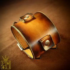 "This sunburst tan Leather cuff bracelet is 2.25\" wide cuff is custom hand dyed . It features two 3/4\" watch connectors and uses two straps/ buckles. The edges are perfectly slicked and sealed and Two top quality stainless steel buckles provide the closure A great width for any wrist! This cuff is inspired by the early Johnny Depp cuffs. can be used with or without a watch! Custom sized for your wrist! Use the instructions in the pics above! - 2.25\" wide - Fine vegetable tanned leather - Vint Vintage Leather Festival Bracelets, Vintage Leather Cuff Bracelet For Festival, Handmade Vintage Leather Wristband, Vintage Handmade Cuff Bracelet For Festivals, Vintage Handmade Adjustable Wristband, Handmade Adjustable Vintage Wristband, Handmade Vintage Adjustable Wristband, Brown Cuff Bracelet For Festival, Brown Cuff Bracelet For Festivals