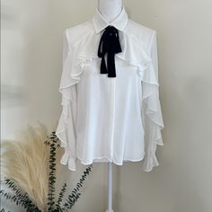 Zara White Ruffled Blouse Flowing Collared Shirt With Long Sleeves, Elastic Cuffs, And Ruffle Trim On The Front. Fastening With A Contrast Tied Bow And Button Up Fastening Hidden By A Placket. Siz: Small Material: 100% Polyester Condition: Nwt Chic Formal Blouse With Ruffle Sleeves, Elegant Ruffled Blouse For Work, Chic Formal Tops With Ruffle Sleeves, White Ruffled Blouse For Office, Elegant Ruffle Sleeve Blouse For Work, Feminine Ruffled Office Shirt, Elegant Workwear Shirt With Ruffled Collar, Elegant Ruffle Sleeve Tops For Office, Elegant Ruffled Tops For Office