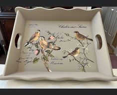 a tray with birds painted on it