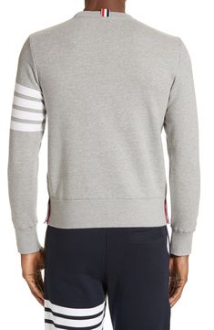 A quartet of thick stripes bands one arm of a well-appointed cotton sweatshirt replete with dapper details like a signature logo patch and a buttoned split hem. Style Name:Thom Browne Stripe Sleeve Sweatshirt. Style Number: 5155852. Sporty Striped Cotton Sweatshirt, Cotton Crew Neck Sweater With Striped Sleeves, Striped Crew Neck Sweatshirt With Ribbed Collar, Classic Hoodie With Ribbed Cuffs, Classic Long Sleeve Sweater With Contrast Stripes, Cotton Striped Sweatshirt With Striped Cuffs, Cotton Sweatshirt With Contrast Stripes And Crew Neck, Cotton Crew Neck Sweatshirt With Contrast Stripes, Cotton Crew Neck Sweatshirt With Striped Cuffs