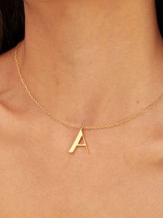 Light in weight but heavy in meaning, our Signature Initial Necklace does more than spell a name. This initial collection is a celebration of people, places, and things that represent you -- creating a deeply meaningful and bespoke piece that is a great go-to piece for every day. Medium in size, the letter pendant is 24K gold-plated and threads through a delicate gold-plated chain. Available in letters A through Z. Dimensions: Sheet Thickness: 0.08in (2mm)Wire Thickness: 0.04in (0.9mm)Overall he Modern Gold Initial Pendant Necklace, Recycled Gold Initial Pendant Necklace Gift, Gift Initial Pendant Necklace In Recycled Gold, Gift Recycled Gold Initial Pendant Necklace, Unique Gold Custom Necklace For Gift, Unique Custom Gold Necklace For Gift, Modern Gold Necklace With Initials, Symbolic Gold Initial Pendant Charm Necklaces, Gold Symbolic Initial Pendant Charm Necklaces