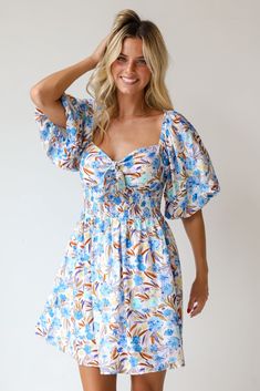 Elevate any look with a darling piece like the Poised Sensibility Blue Floral Mini Dress! Perfect for a variety of occasions, this dress offers both style and comfort in a beautifully designed package. The dress features a captivating blue background adorned with delicate floral prints, creating a fresh and feminine look. The puff sleeves add a touch of whimsy and romance, enhancing the dress's overall playful and elegant appeal. Whether you're heading to a casual brunch, a summer garden party, Blue Floral Mini Dress, Summer Garden Party, Feminine Look, Summer Garden, Floral Mini Dress, New Wardrobe, Blue Background, Garden Party, Sweetheart Neckline