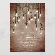 an image of a wedding card with lights hanging from the ceiling and greenery on it