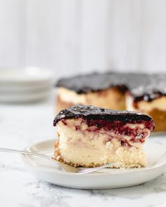 a piece of cheesecake on a plate with a fork