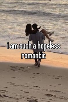 a man carrying a woman on his back while walking along the beach with text that reads, i am such a hopeless romantic