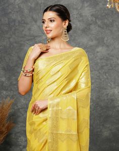 Yellow Woven Banarasi Georgette Saree  Yellow Woven Banarasi Georgette Saree is a luxurious and elegant piece. The intricate weaving patterns, often featuring floral motifs or geometric designs, create a rich and textured fabric. The georgette base adds a touch of softness and flowiness, making it comfortable to wear.  Features Of Yellow Woven Banarasi Georgette Saree  Traditional Handloom Craft  Intricate Gold Brocade Work  Durability and Longevity   Size Fit  The model height is 5.7 ft   WASH Gold Pre-draped Saree With Cutdana In Georgette, Gold Brocade Pre-draped Saree With Zari Weaving, Elegant Yellow Pre-draped Saree With Zari Weaving, Transitional Brocade Saree For Puja, Brocade Saree For Puja And Transitional Season, Gold Georgette Pre-draped Saree For Navratri, Transitional Season Brocade Saree For Puja, Gold Chanderi Choli With Motifs, Gold Brocade Saree With Unstitched Blouse