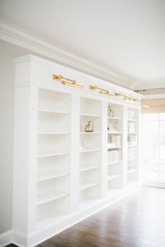 a white bookcase with lots of books on it and the text pinterest get this free app for more ideas