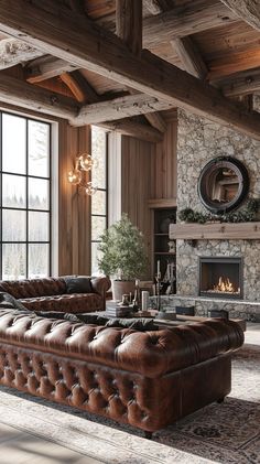 a living room filled with furniture and a fire place next to a stone wall covered in logs