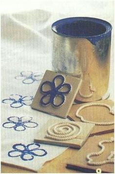 some cookie cutters sitting on top of a table next to a cup and scissors