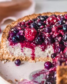 a cheesecake with blueberries and crumbles on it