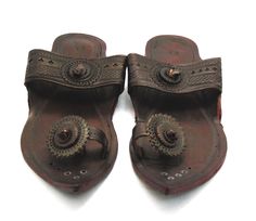 Check out our brand-new, genuine handcrafted Kolhapuri sliding sandals from India, high-quality leather sandals with an ethnic Indian toe strap that are incredibly comfortable and simple to use. The leather is prepared in such a way that it has no allergenic characteristics at all and feels light, smooth, and silky. Hand stitching and punching are being used. These men slippers are ideal for everyday use as well as for any formal event. We offer various different shoe styles. For more of our selection, visit our page! We send packages to you promptly and well packaged for a safe journey. We appreciate your support of our little business. Shipped from the USA. Traditional Closed Toe Sandals With Leather Footbed, Leather Sandals For Festivals, Traditional Leather Footbed Sandals For Beach, Traditional Leather Sandals With Single Toe Strap, Festival Sandals With Leather Sole And Single Toe Strap, Leather Toe Ring Sandals For Festivals, Leather Toe Ring Sandals With Single Strap For Festivals, Traditional Brown Leather Slippers, Traditional Leather Toe Ring Sandals For Festivals